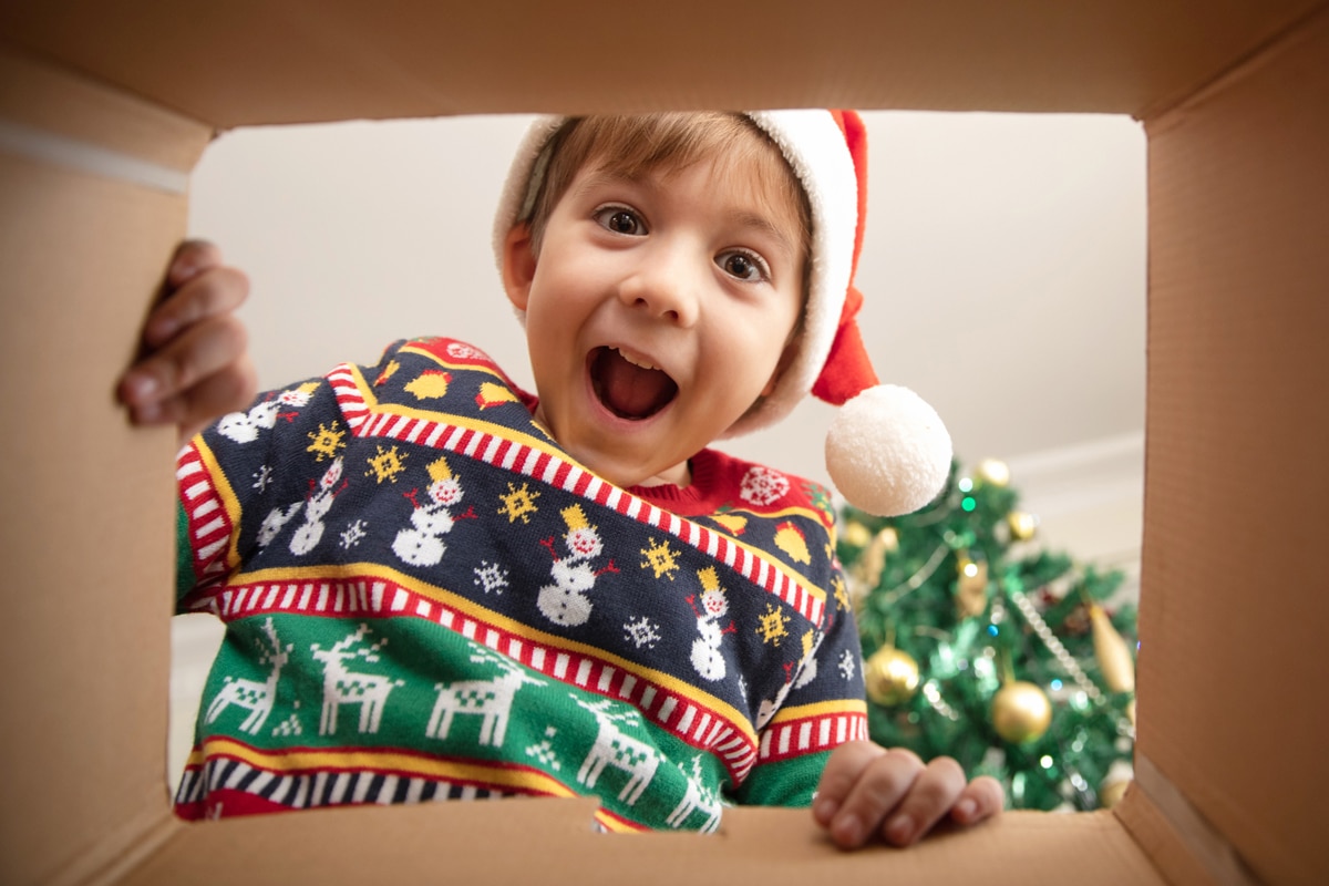 kid-lookoing-into-a-holiday-gift-box